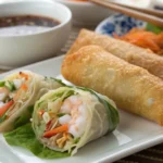 Egg roll and spring roll side by side.